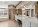 Luxurious bathroom featuring double sinks, shower, tub, and tile floors at 5174 Se 41St Ave, Ocala, FL 34480