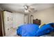 Bedroom featuring a ceiling fan and built-in wardrobe, and closet at 5174 Se 41St Ave, Ocala, FL 34480