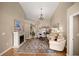 Bright and airy living room featuring a fireplace, high ceilings, and neutral color palette at 5174 Se 41St Ave, Ocala, FL 34480
