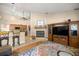 Living room with fireplace flowing into the kitchen at 5174 Se 41St Ave, Ocala, FL 34480