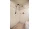 Shower featuring stone tile and dual shower heads at 5174 Se 41St Ave, Ocala, FL 34480