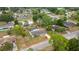 Aerial view of a single-Gathering home featuring a screened-in pool and a spacious, fenced backyard at 5720 Se 20Th St, Ocala, FL 34480