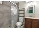 Modern bathroom with tiled shower, sleek vanity, and updated fixtures at 5720 Se 20Th St, Ocala, FL 34480