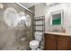 This bathroom is updated with a tile shower featuring a unique design, and a modern vanity at 5720 Se 20Th St, Ocala, FL 34480