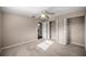 This bedroom features neutral walls, carpeted floors, closet space and a ceiling fan at 5720 Se 20Th St, Ocala, FL 34480