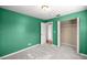 Cozy bedroom featuring a closet, carpet, and a view of an adjacent space at 5720 Se 20Th St, Ocala, FL 34480
