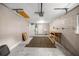 Spacious garage with concrete block wall, workbench, and white doors at 5720 Se 20Th St, Ocala, FL 34480