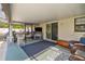 Outdoor patio includes cozy seating, a fireplace, and a TV area at 5720 Se 20Th St, Ocala, FL 34480