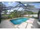 Screened-in pool area with a pool and plenty of space for lounging at 5720 Se 20Th St, Ocala, FL 34480