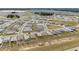 Aerial shot of an upscale planned neighborhood with homes, green lawns, and roads in sunny Florida at 5842 Sw 78Th Avenue Rd, Ocala, FL 34474