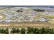 Expansive aerial view showcasing a well-planned community with numerous single-Gathering homes and verdant landscaping at 5842 Sw 78Th Avenue Rd, Ocala, FL 34474