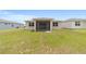 Expansive backyard offers ample green space, with screened patio perfect for relaxation at 5842 Sw 78Th Avenue Rd, Ocala, FL 34474