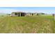 A large grass backyard provides plenty of room to enjoy outdoor living and recreation at 5842 Sw 78Th Avenue Rd, Ocala, FL 34474