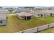 Aerial view of backyard with a screen porch, a well manicured lawn, and a modern fence in background at 5842 Sw 78Th Avenue Rd, Ocala, FL 34474