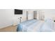Bright, airy bedroom featuring a flat screen TV and simple decor at 5842 Sw 78Th Avenue Rd, Ocala, FL 34474