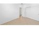 A bright, unfurnished bedroom offering a calm, uncluttered space with a closet at 5842 Sw 78Th Avenue Rd, Ocala, FL 34474