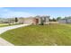 Inviting single-story home with a lush green lawn and tidy landscaping, along with an attached two car garage at 5842 Sw 78Th Avenue Rd, Ocala, FL 34474