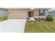 Lovely single-story home boasting a manicured lawn and vibrant landscaping, with an attached two-car garage at 5842 Sw 78Th Avenue Rd, Ocala, FL 34474