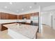 Bright kitchen with stainless steel appliances, granite countertops, and central island at 5842 Sw 78Th Avenue Rd, Ocala, FL 34474
