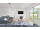 Living room showing tile floors, recessed lighting, flat screen TV, and access to the lanai at 5842 Sw 78Th Avenue Rd, Ocala, FL 34474