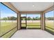 Screened patio overlooking a spacious backyard and providing seamless indoor-outdoor living at 5842 Sw 78Th Avenue Rd, Ocala, FL 34474