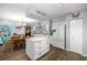 Spacious open kitchen with white cabinetry, stainless steel appliances, and an adjacent dining area at 6070 Se 39Th Ave, Ocala, FL 34480