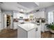 Bright kitchen featuring white cabinets, a center island, stainless appliances, and modern fixtures at 6070 Se 39Th Ave, Ocala, FL 34480