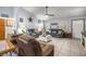 Bright living room boasts tile flooring, neutral paint, comfortable seating, and plenty of natural light at 6070 Se 39Th Ave, Ocala, FL 34480