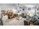 Cozy living room featuring tile floors, comfortable seating, and charming decorative accents at 6070 Se 39Th Ave, Ocala, FL 34480
