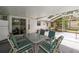 Covered patio with dining furniture, providing a comfortable outdoor entertaining space at 6070 Se 39Th Ave, Ocala, FL 34480
