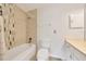Bright bathroom featuring a tub and shower combination with decorative tiling at 6350 Nw 135Th Ave, Morriston, FL 32668