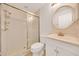 A full bathroom with glass shower doors, a white vanity, and neutral decor at 6350 Nw 135Th Ave, Morriston, FL 32668