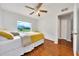 Bedroom features natural light, hardwood floors, and a scenic window view at 6350 Nw 135Th Ave, Morriston, FL 32668