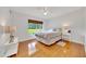 Bright bedroom featuring a window with outside view and hardwood floors at 6350 Nw 135Th Ave, Morriston, FL 32668