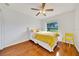Bedroom features natural light, a ceiling fan, and hardwood floors at 6350 Nw 135Th Ave, Morriston, FL 32668
