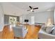 Bright living room with hardwood floors, a ceiling fan, and contemporary furnishings at 6350 Nw 135Th Ave, Morriston, FL 32668