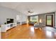Open living area with hardwood floors, neutral walls, and ample natural light at 6350 Nw 135Th Ave, Morriston, FL 32668