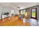 Open living area with hardwood floors, neutral walls, and ample natural light at 6350 Nw 135Th Ave, Morriston, FL 32668