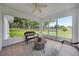 Enjoy the serene views from this screened patio with cozy seating at 6350 Nw 135Th Ave, Morriston, FL 32668