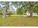 Picturesque property featuring multiple sheds, mature trees, and fenced pastures, ideal for outdoor enthusiasts at 6350 Nw 135Th Ave, Morriston, FL 32668