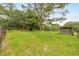 Expansive property with lush green fields, mature trees, and wooden structures, offering a peaceful countryside feel at 6350 Nw 135Th Ave, Morriston, FL 32668
