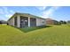 Spacious screened patio overlooking a large backyard, perfect for outdoor entertaining at 6405 Sw 88Th Loop, Ocala, FL 34476