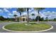 Community clubhouse surrounded by palm trees and lush landscaping, perfect for community events at 6405 Sw 88Th Loop, Ocala, FL 34476