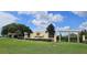 Welcoming community entrance with landscaping and a decorative neighborhood sign at 6405 Sw 88Th Loop, Ocala, FL 34476