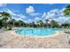 Community pool featuring ample lounge seating and nearby shade structures at 6405 Sw 88Th Loop, Ocala, FL 34476