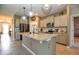 Modern kitchen with granite island, stainless appliances, and stylish pendant lighting at 6405 Sw 88Th Loop, Ocala, FL 34476
