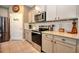 Bright kitchen featuring stainless appliances, granite countertops, and tile backsplash at 6405 Sw 88Th Loop, Ocala, FL 34476