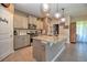 Bright kitchen with large island, granite counters, stainless appliances, and stylish pendant lighting at 6405 Sw 88Th Loop, Ocala, FL 34476