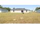 Expansive backyard with room for a pool and entertaining with a fire pit and patio at 6561 Sw 129Th Loop, Ocala, FL 34473