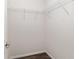 Walk-in closet featuring wire shelving, wood-look flooring, and fresh paint throughout at 6561 Sw 129Th Loop, Ocala, FL 34473
